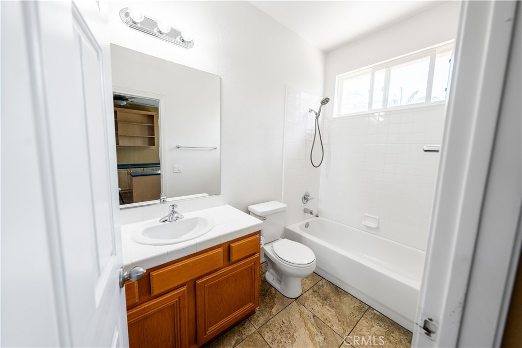 31465 Inverness Court Temecula, CA 92591 - Photo 47 of 71 a bathroom with a sink a toilet and shower