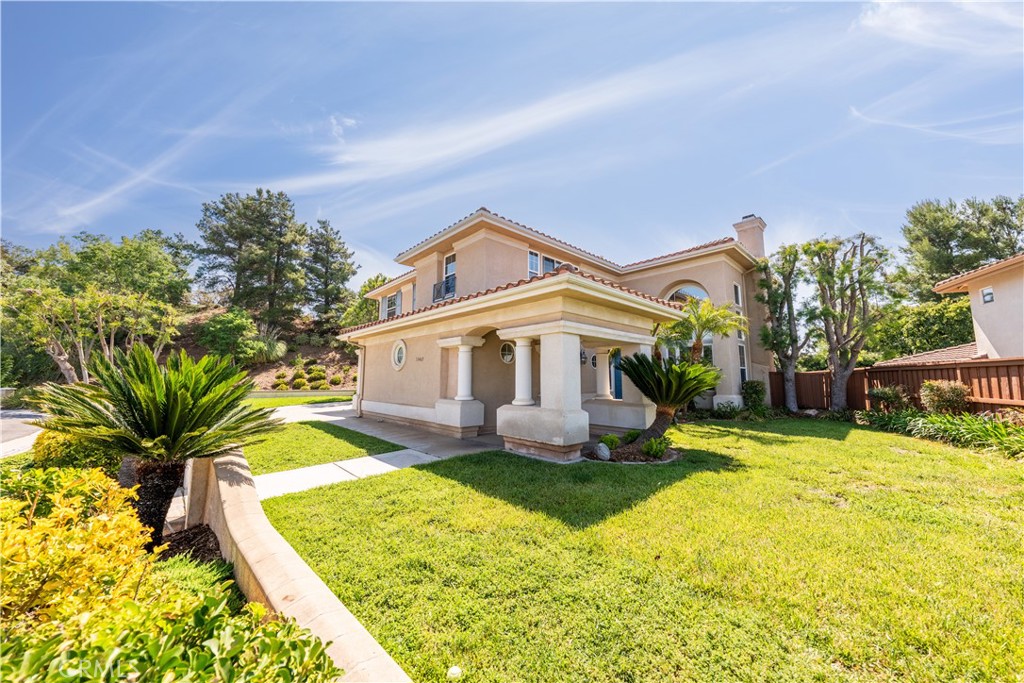 31465 Inverness Court Temecula, CA 92591 - Photo 7 of 71 a front view of a house with a yard table and chairs