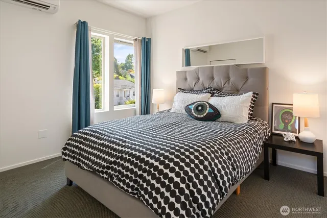 a bedroom with bed and window