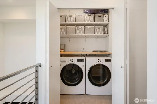 a close view of a utility room with dryer and washer