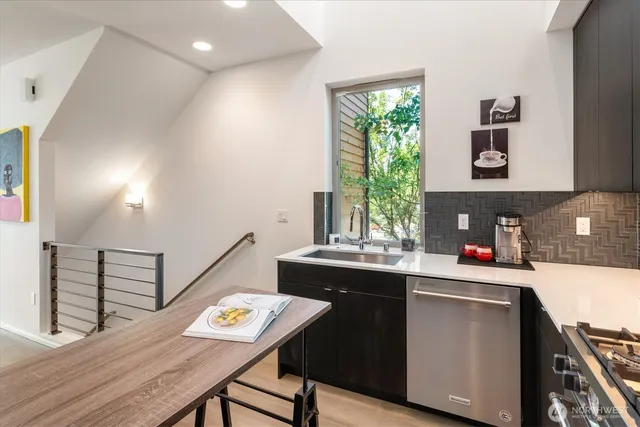 a kitchen that has a table and chair in it