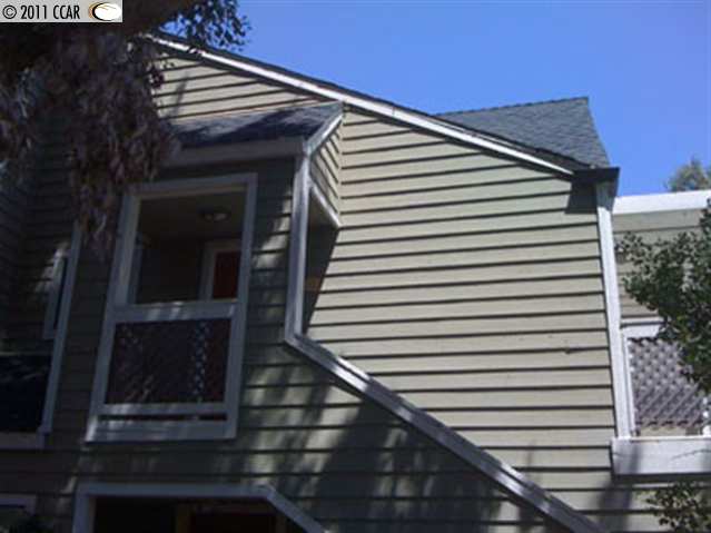 115 Reflections Drive, Unit 25 San Ramon, CA 94583 - Photo 1 of 1 a view of a house with a door and wooden floor