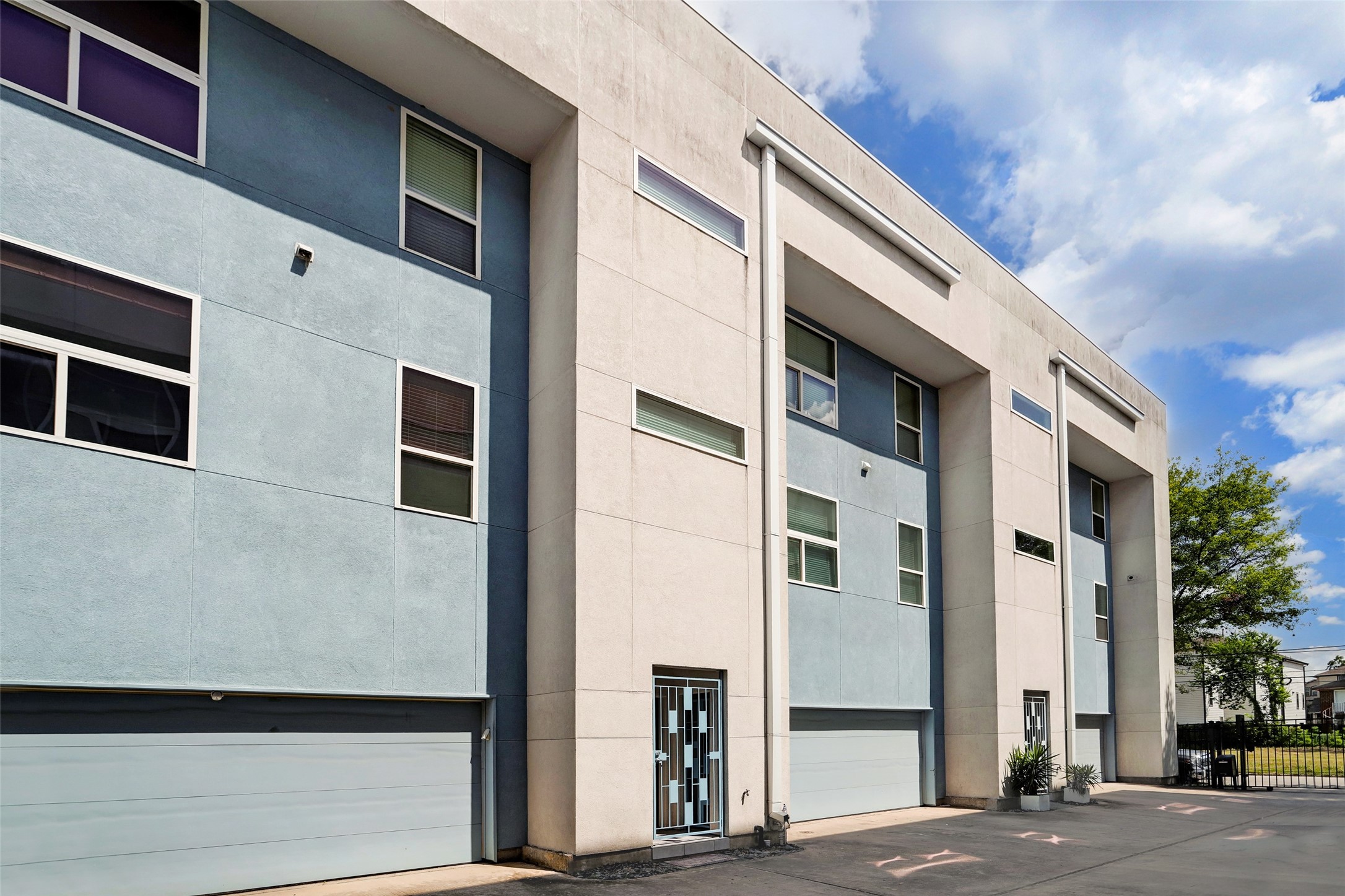 1820 Prospect Street Houston, TX 77004 - Photo 1 of 18 a front view of a building with a blue gate