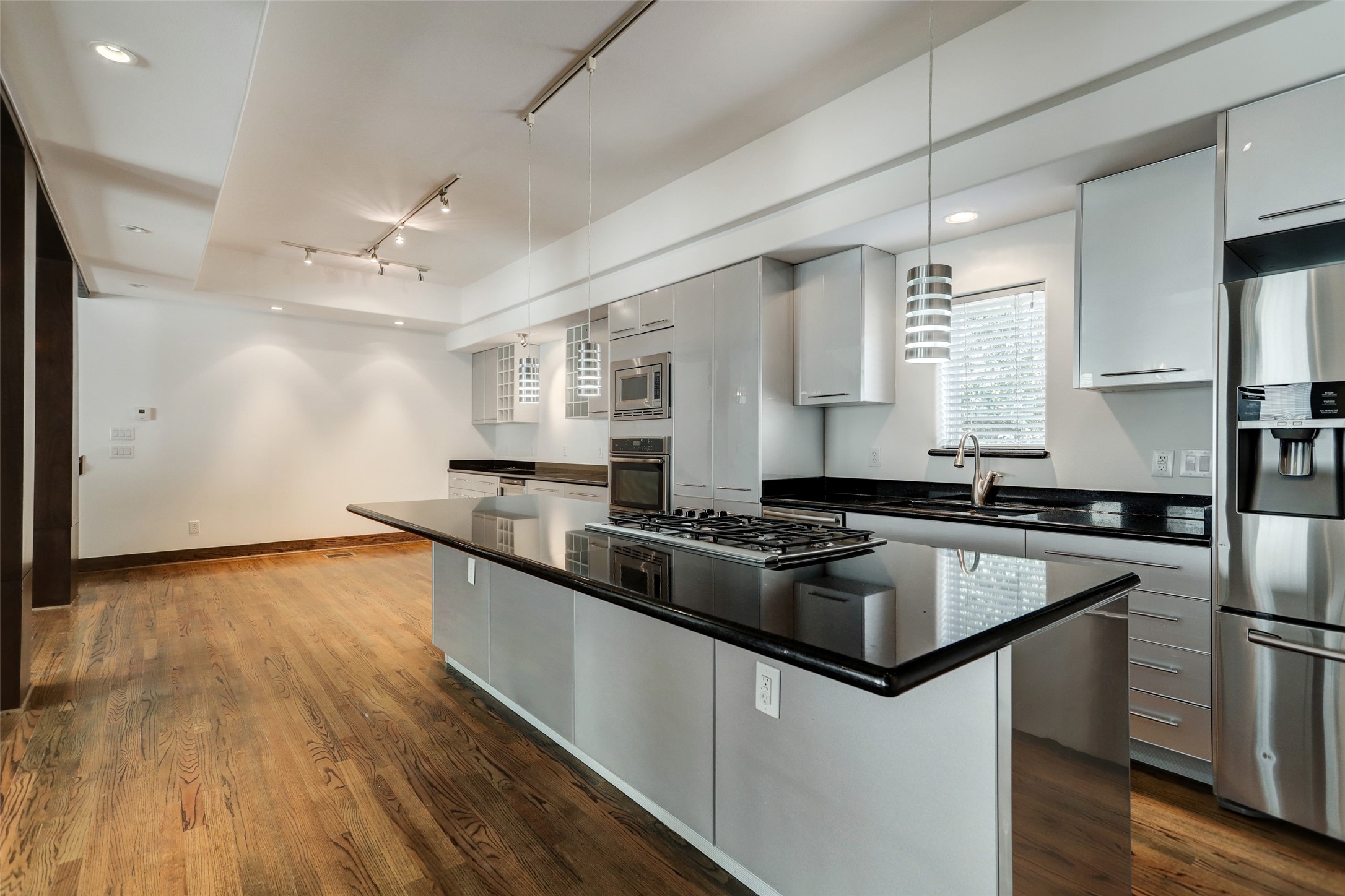 1820 Prospect Street Houston, TX 77004 - Photo 11 of 18 a kitchen with granite countertop a sink and refrigerator
