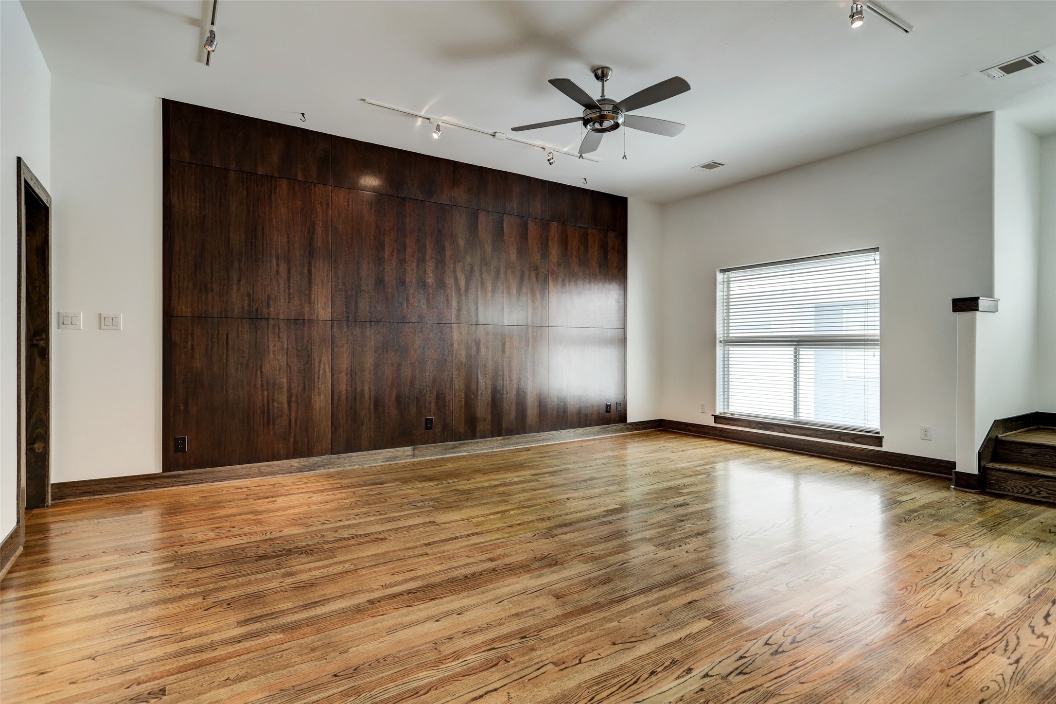 1820 Prospect Street Houston, TX 77004 - Photo 14 of 18 a view of an empty room with window and wooden floor