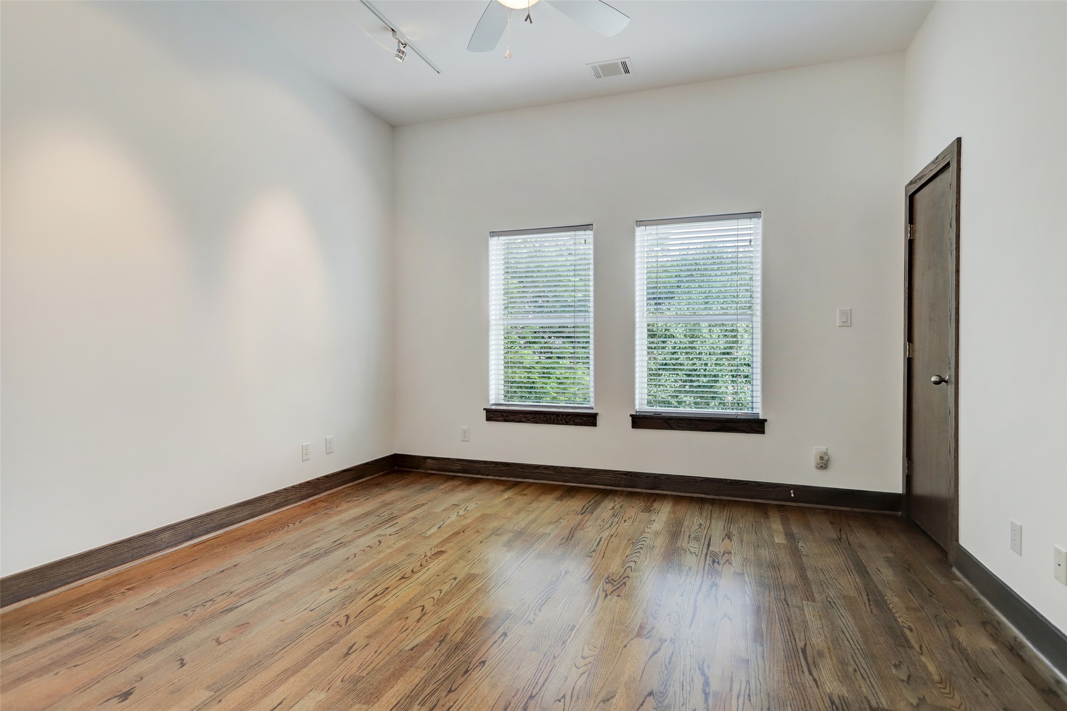 1820 Prospect Street Houston, TX 77004 - Photo 15 of 18 an empty room with wooden floor and windows