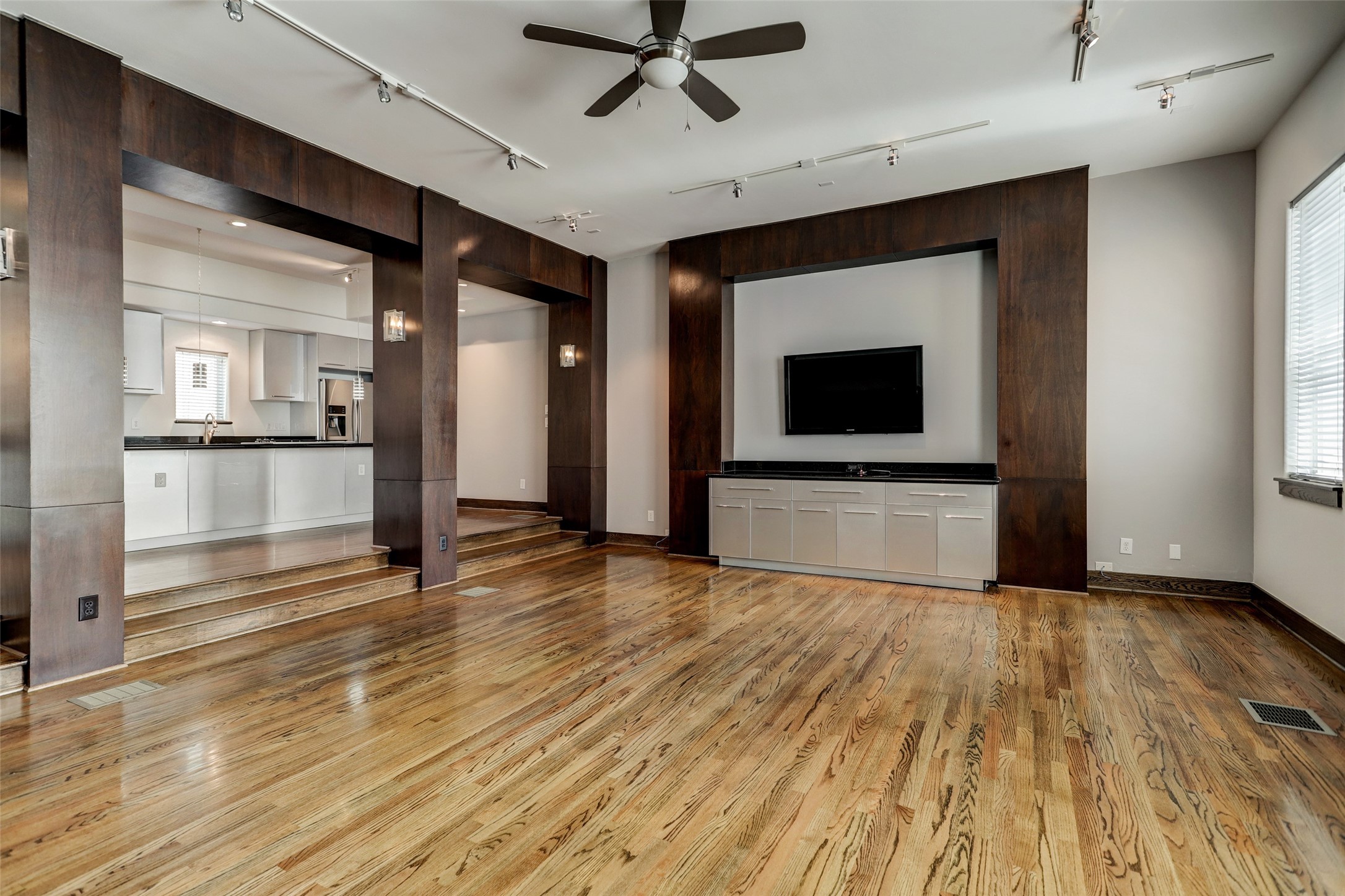 1820 Prospect Street Houston, TX 77004 - Photo 7 of 18 a view of a livingroom with wooden floor and a ceiling fan