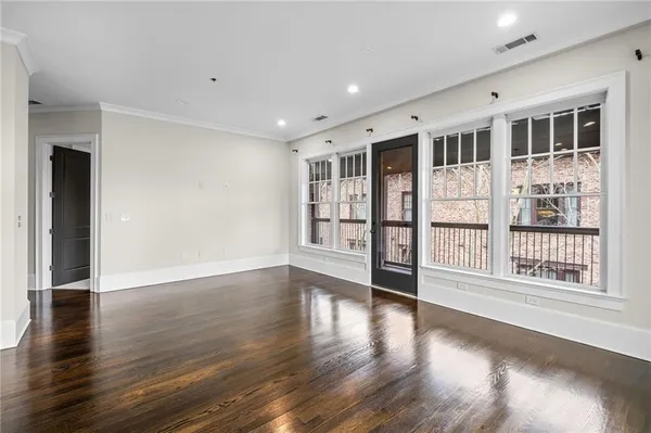 a view of kitchen with wooden floor and windows