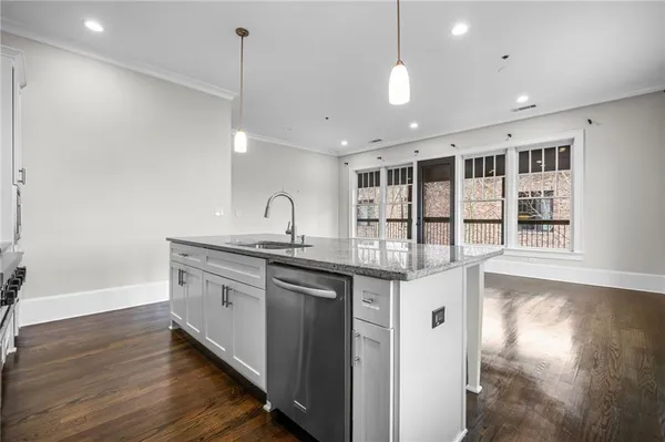 a balcony with furniture and a potted plant