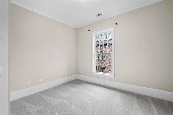 a view of a livingroom with a ceiling fan and window
