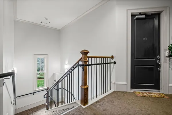 a view of hallway with wooden floor