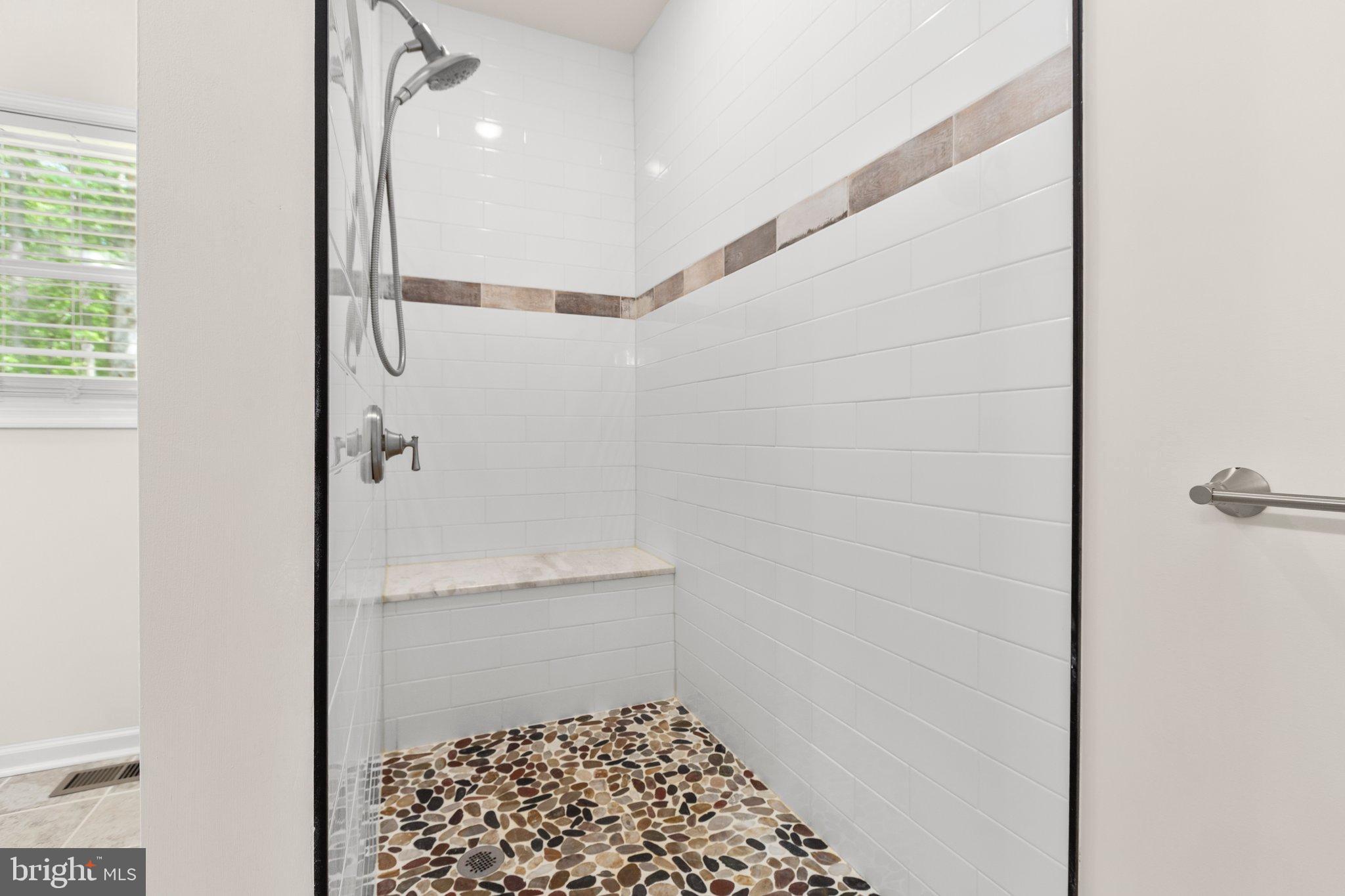 4331 French Acors Road Spotsylvania, VA 22551 - Photo 31 of 42 Sleek modern shower with natural stone floor.