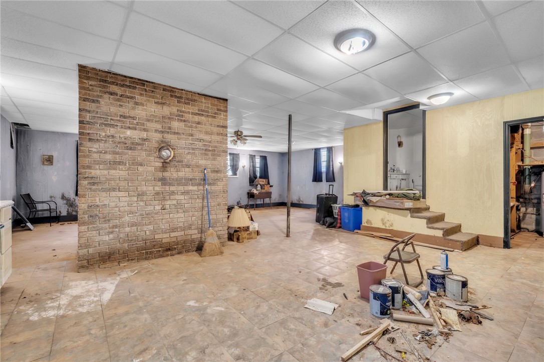 602 Harper Road Pendleton, SC 29670 - Photo 25 of 32 A spacious unfinished basement awaits transformation, featuring exposed brick and abundant renovation potential.