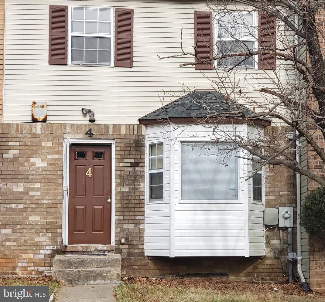 4 Mainview Court Randallstown, MD 21133 - Photo 1 of 25 a view of a house with a door and wooden walls