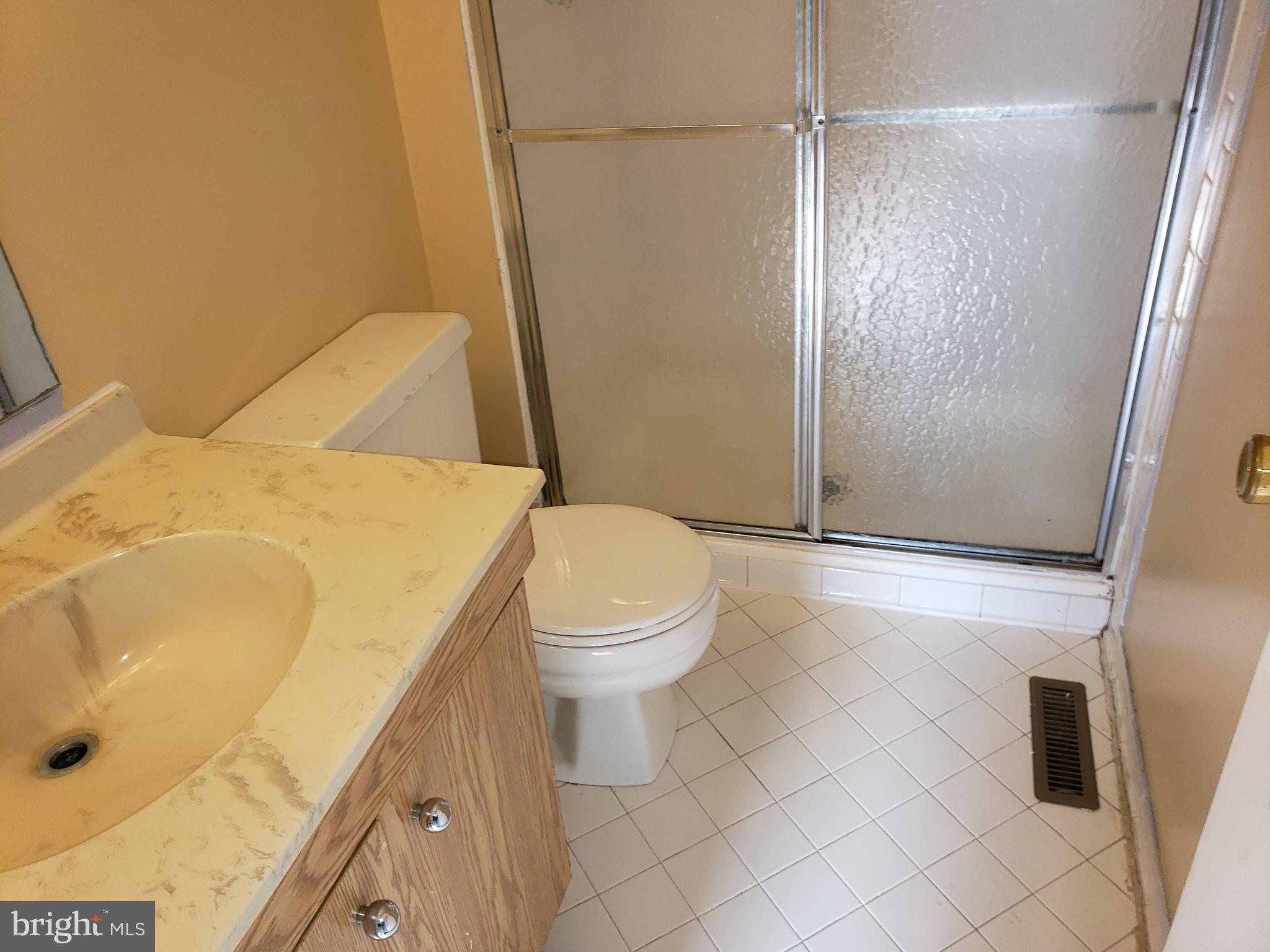 4 Mainview Court Randallstown, MD 21133 - Photo 12 of 25 a bathroom with a sink and a shower