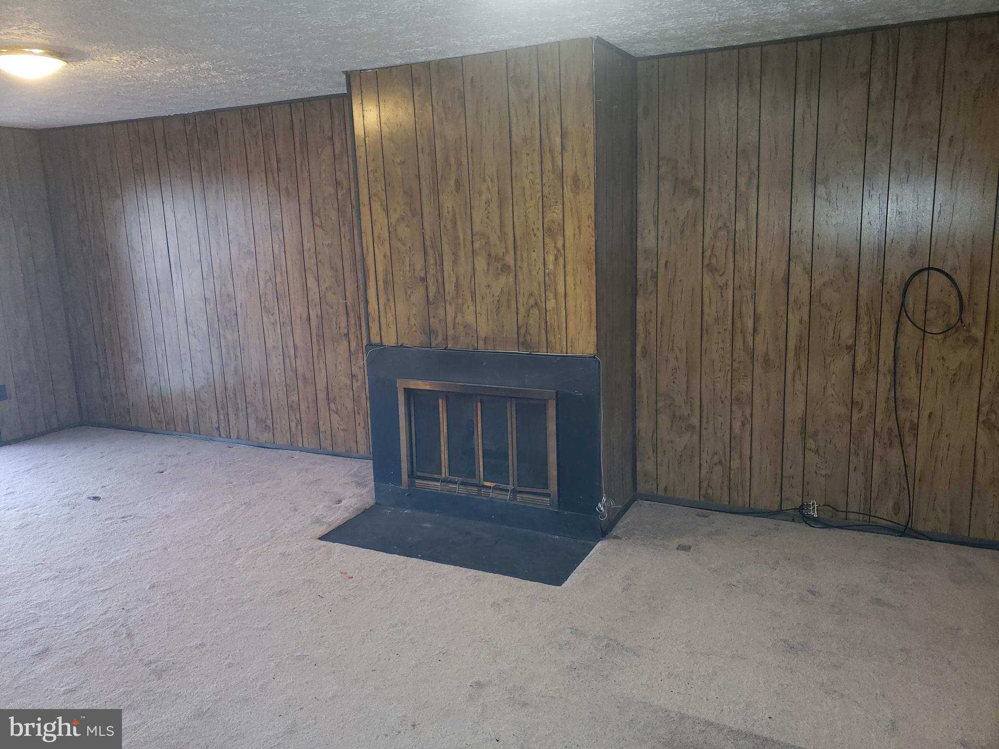 4 Mainview Court Randallstown, MD 21133 - Photo 18 of 25 an empty room with a fireplace