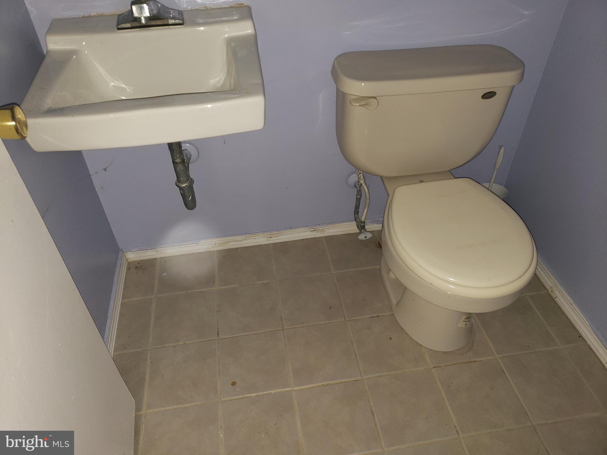 4 Mainview Court Randallstown, MD 21133 - Photo 20 of 25 a bathroom with a toilet and a sink