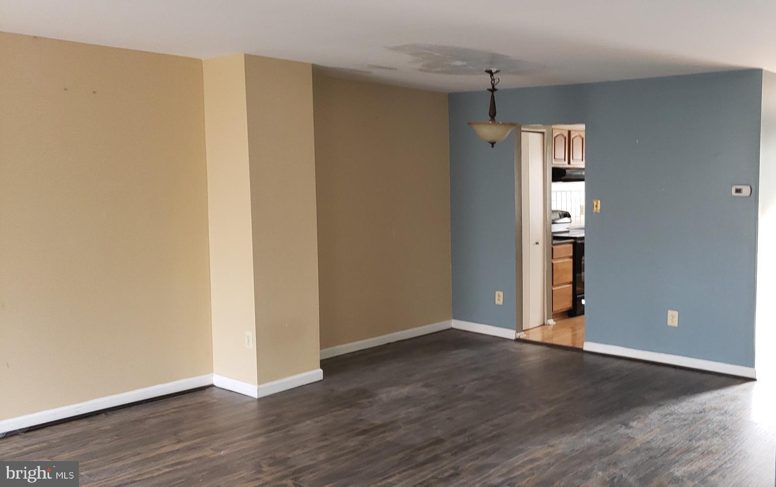 4 Mainview Court Randallstown, MD 21133 - Photo 7 of 25 a view of an empty room with wooden floor and closet