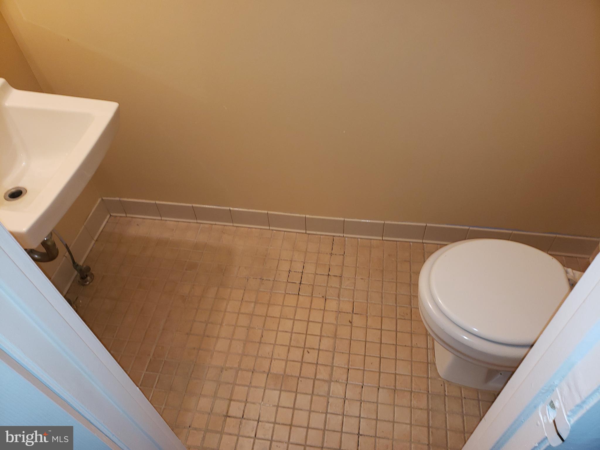 4 Mainview Court Randallstown, MD 21133 - Photo 9 of 25 a bathroom with a toilet and a shower