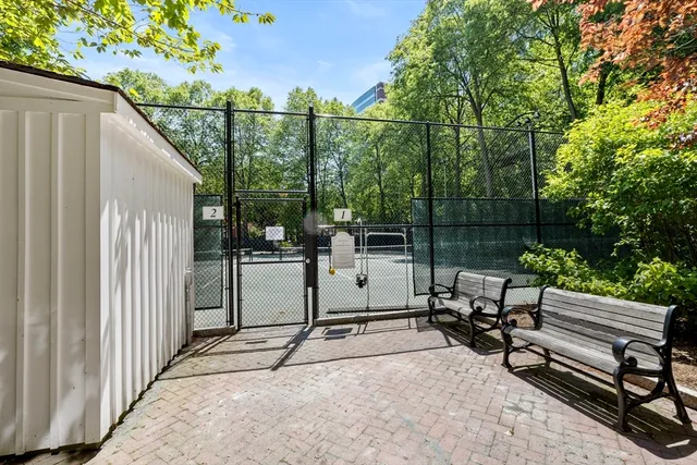 a view of a chair and tables in the balcony