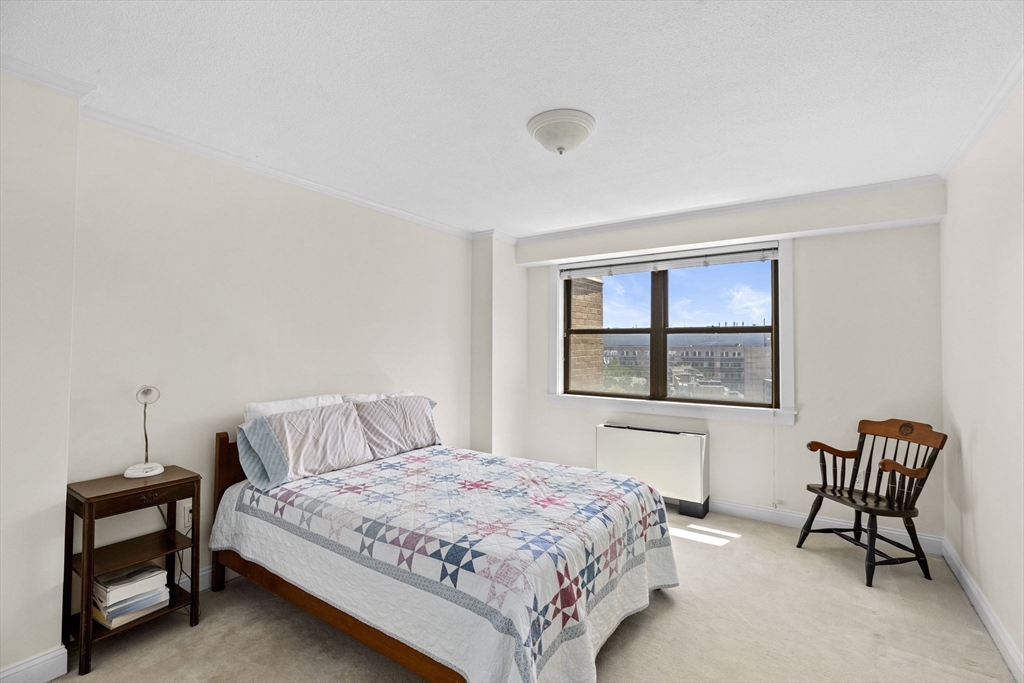 9 Hawthorne Place, Unit 14N Boston, MA 02114 - Photo 8 of 15 a bedroom with a bed and a window