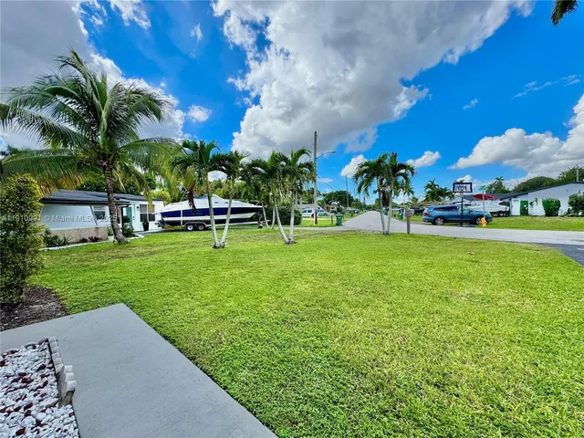 an aerial view of a house with a garden