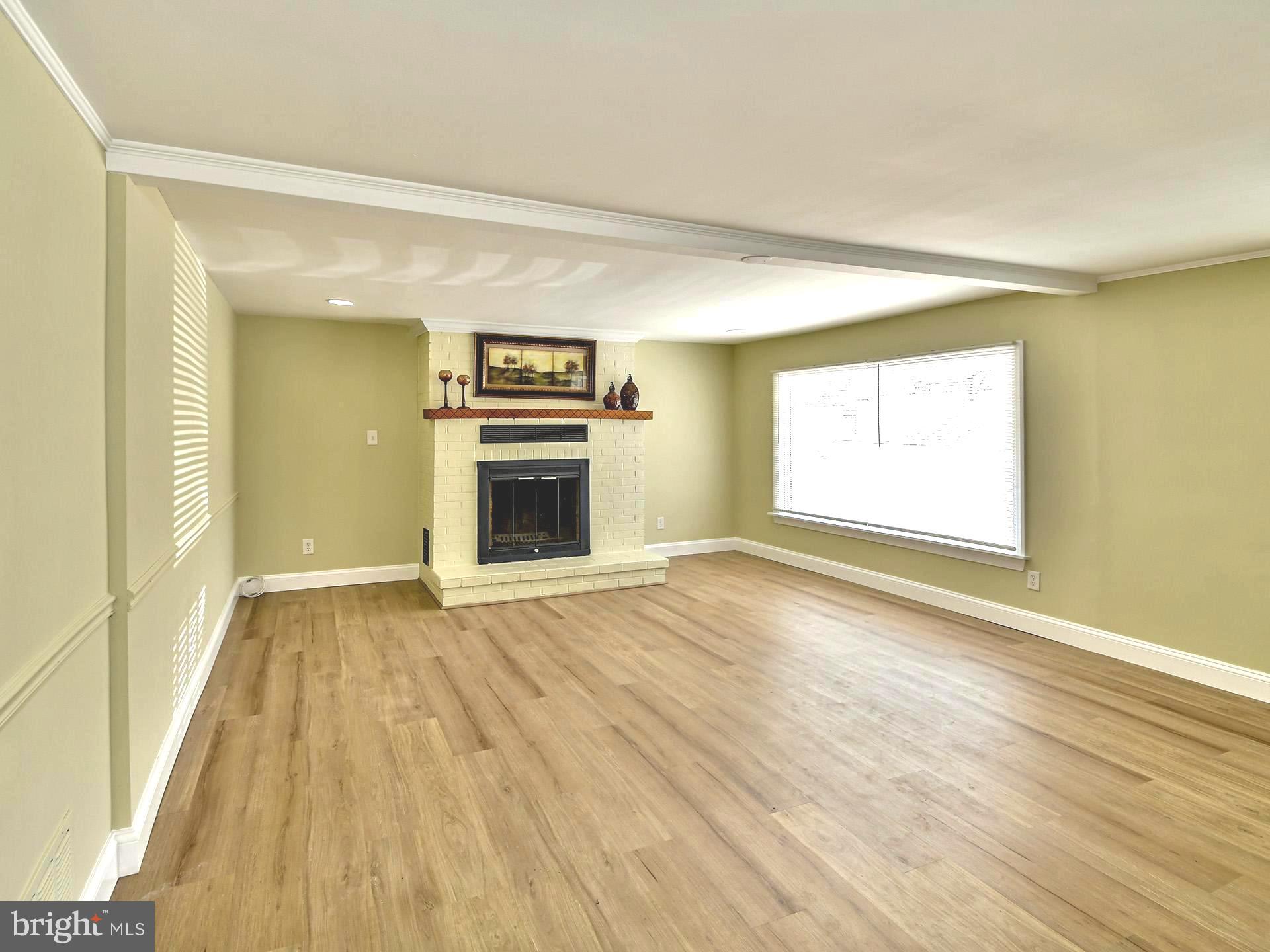 3020 Old Gamber Road Finksburg, MD 21048 - Photo 11 of 39 Bright family room with new wood vinyl flooring