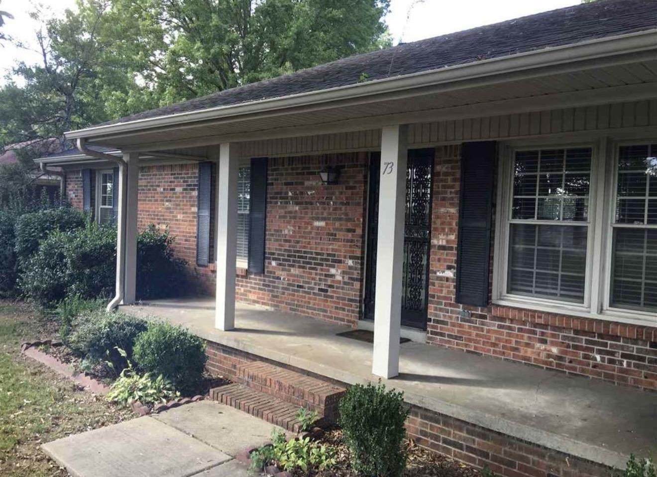 73 Hughes Drive Jackson, TN 38305 - Photo 1 of 24 a front view of a house with a porch