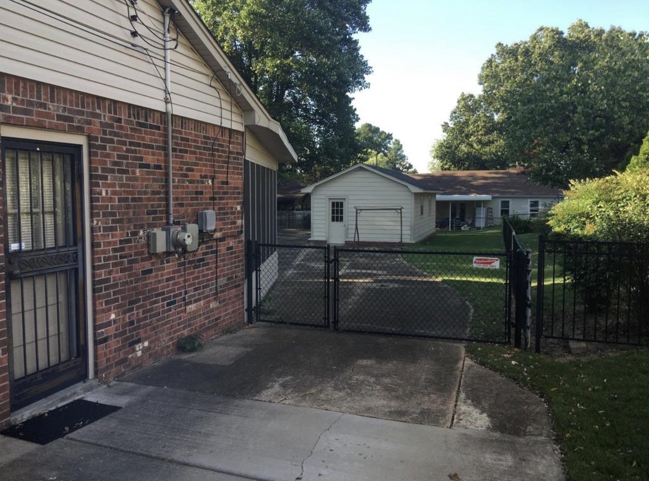 73 Hughes Drive Jackson, TN 38305 - Photo 11 of 24 a front view of a house with a yard