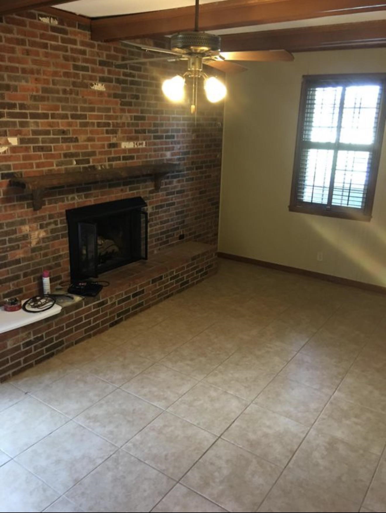 73 Hughes Drive Jackson, TN 38305 - Photo 17 of 24 a view of empty room with a fireplace