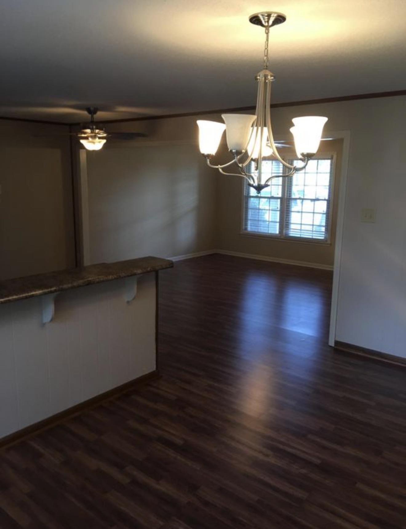 73 Hughes Drive Jackson, TN 38305 - Photo 19 of 24 a view of dining room with wooden floor