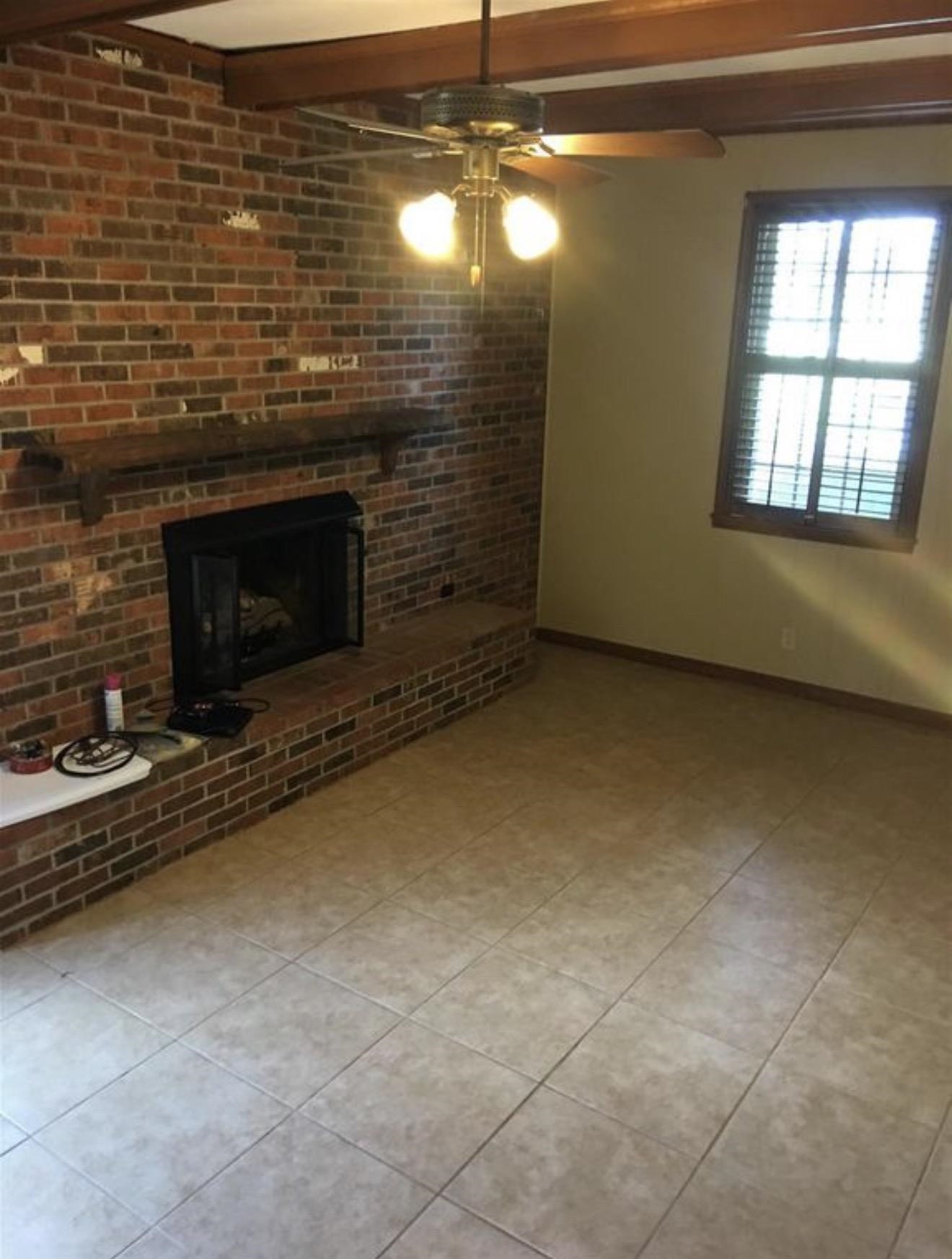 73 Hughes Drive Jackson, TN 38305 - Photo 2 of 24 a view of empty room with a fireplace
