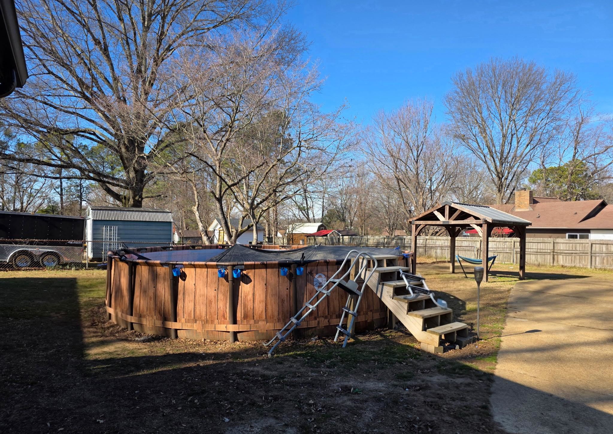 73 Hughes Drive Jackson, TN 38305 - Photo 24 of 24 a view of a house with backyard water fountain and sitting area