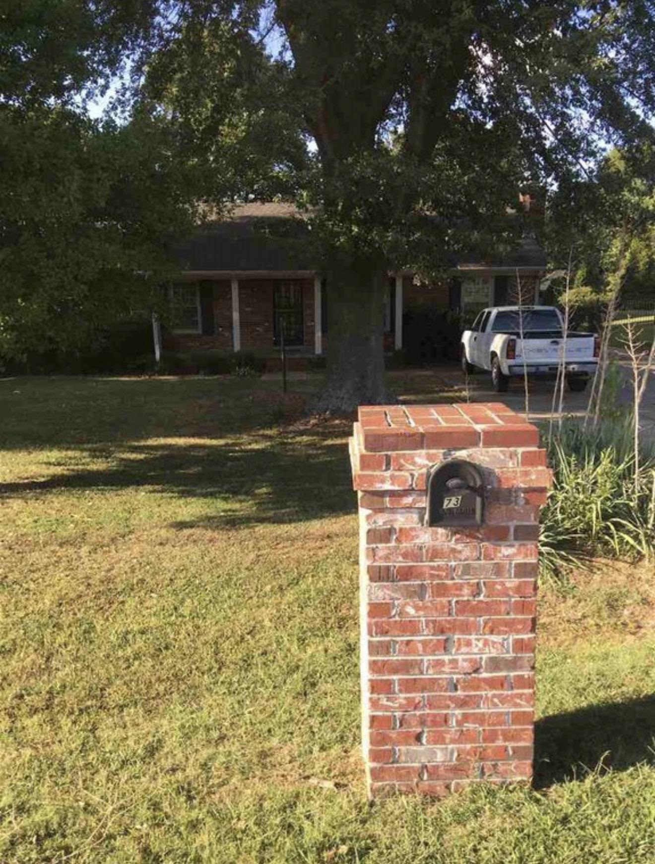 73 Hughes Drive Jackson, TN 38305 - Photo 8 of 24 a backyard of a house with lots of green space