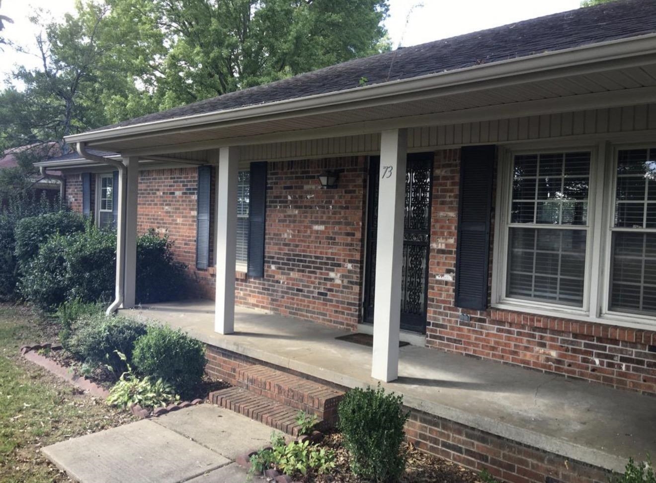 73 Hughes Drive Jackson, TN 38305 - Photo 10 of 24 a front view of a house with a porch