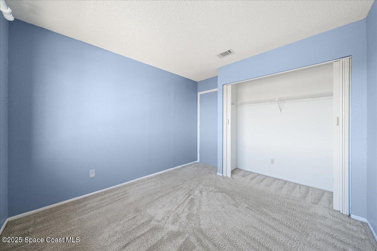 1470 Sheafe Avenue Northeast, Unit 104 Palm Bay, FL 32905 - Photo 23 of 30 19-Bedroom
