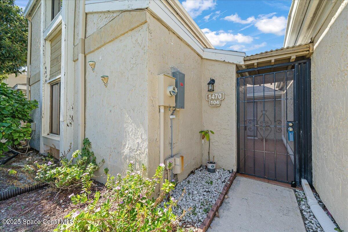 1470 Sheafe Avenue Northeast, Unit 104 Palm Bay, FL 32905 - Photo 8 of 30 Courtyard entry
