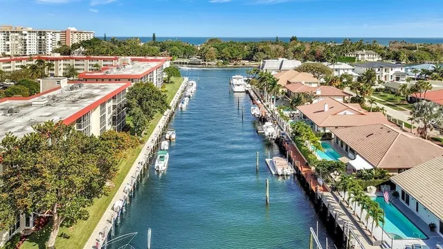 an empty room with wooden floor and fireplace