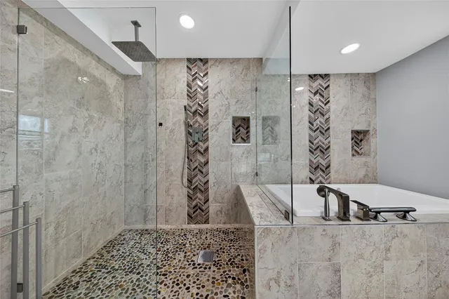 an aerial view of a city with a lake view