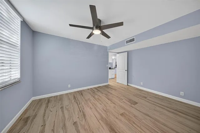 a kitchen with stainless steel appliances granite countertop a refrigerator and a stove