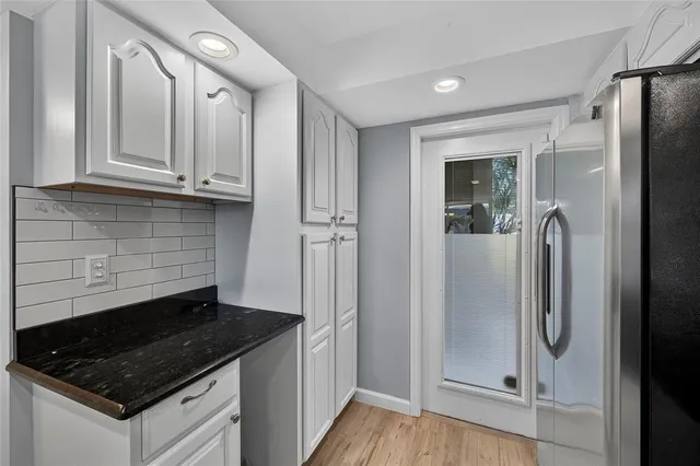 an aerial view of a house with yard swimming pool and outdoor seating