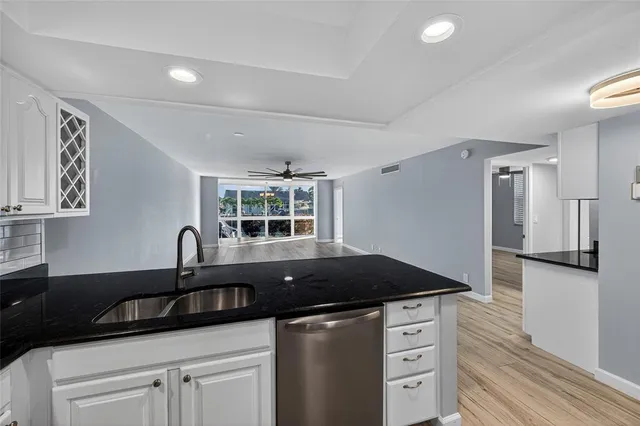 an aerial view of a house with outdoor space and lake view