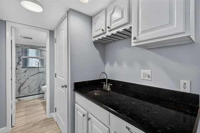 an aerial view of a house with outdoor space and lake view