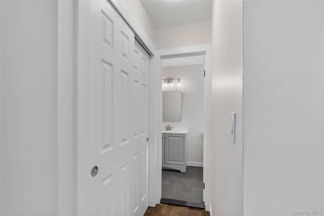 a bathroom with a granite countertop sink