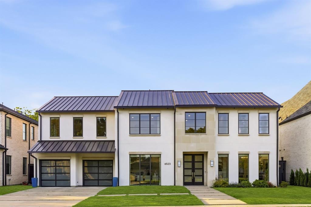 6523 Northwood Road Dallas, TX 75225 - Photo 2 of 36 a view of a big yard with large windows