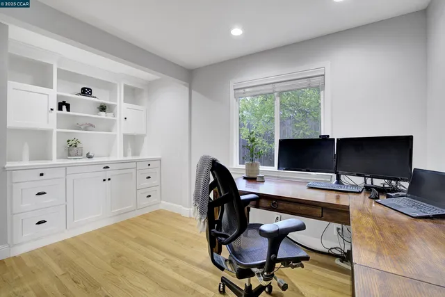 a workspace with furniture and window