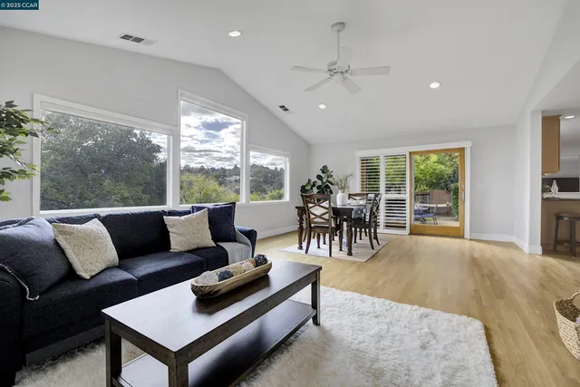 a living room with furniture and a table
