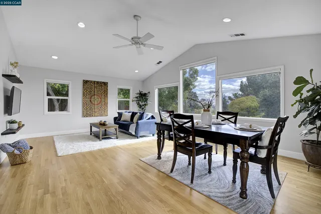 a view of a dining room with furniture window and outside view