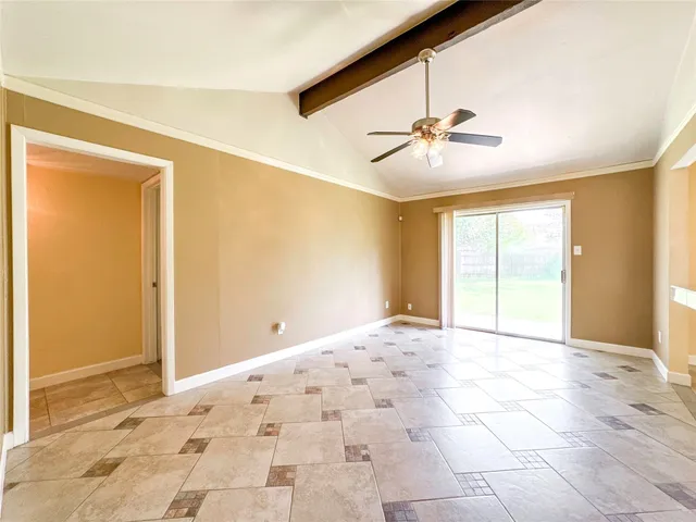 a view of an empty room with a window
