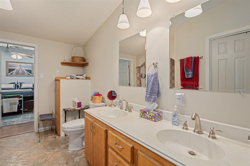 175 Kings Row Malakoff, TX 75148 - Photo 21 of 40 a bathroom with a sink vanity mirror and toilet